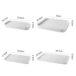 plateau rangement blanc moderne grille perforations tasse thé théière fruits tapis sol écologique