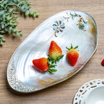 assiette ovale motifs floraux ornementations multicolores classique élégant fruits décoratif blanc table manger