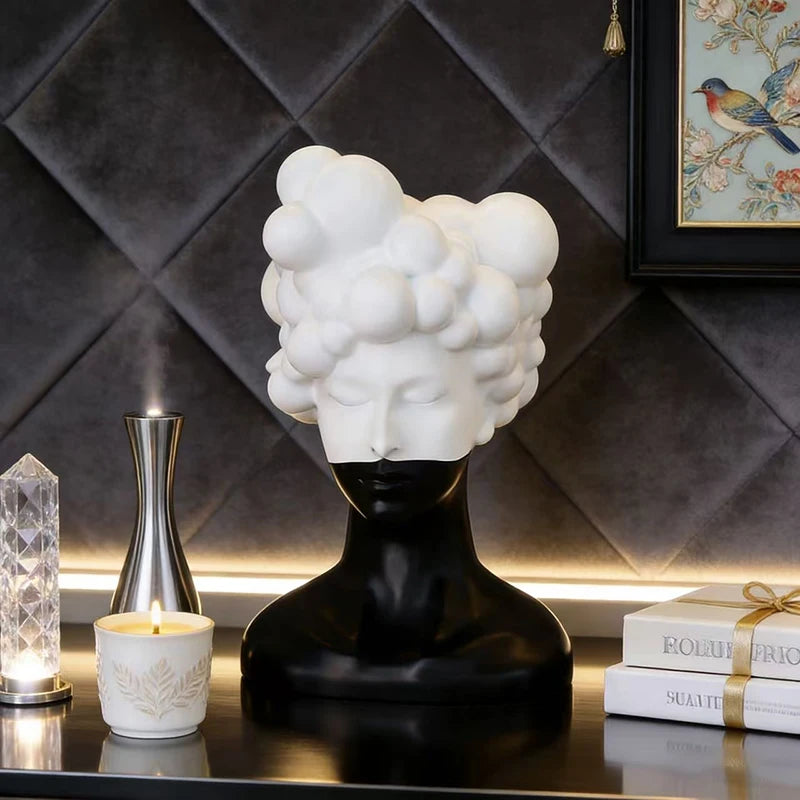 statue tête noire blanche texture mat moderne abstraite bougie concombre loupe livres lampe