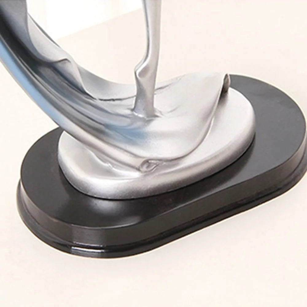 statue moderne femme mouvement argenté doré bleu lisse brillante base noire abstraite