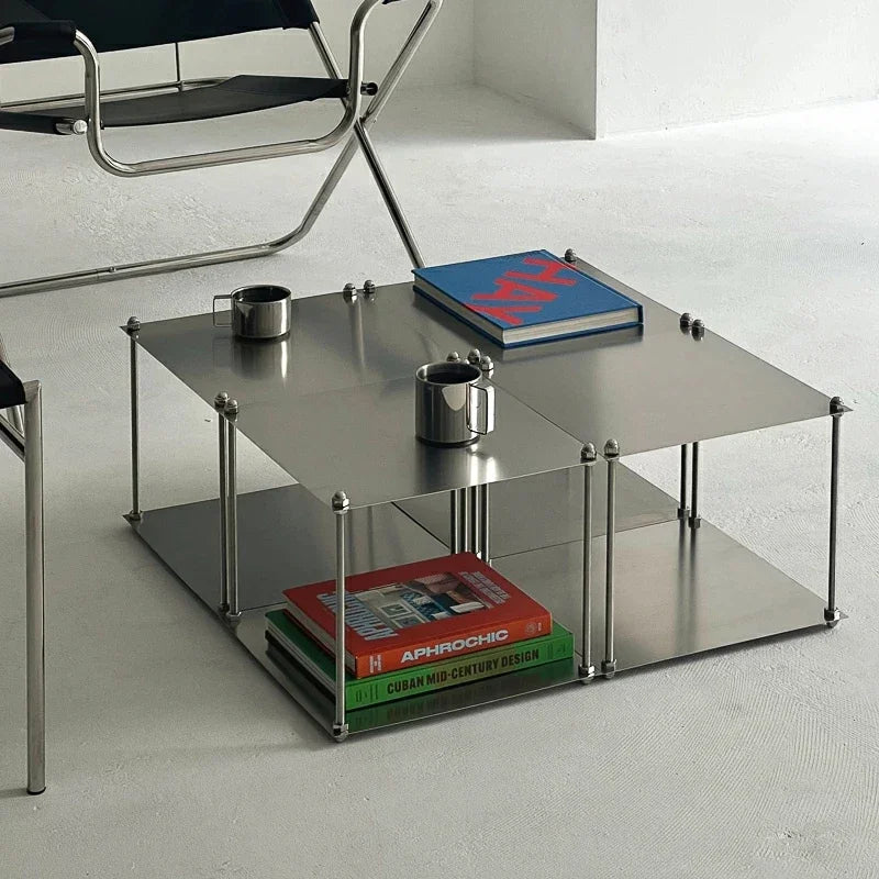table d'appoint moderne gris métallisé lisse brillante tasse livre vis