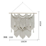 tapisserie macramé boho chic motifs géométriques franges beige clair tige bois crochets métalliques