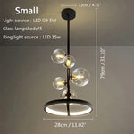 suspension lumineuse moderne sphères verre transparent anneaux métalliques noir doré grisclair