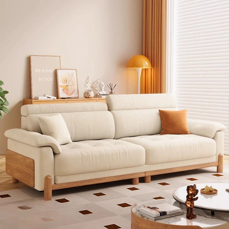 canapé places minimaliste moderne beige clair coussins ajustables table basse bois textures douces surpiqures