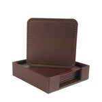 Boîte de sous-verres carrés en cuir brun foncé avec bordures piquées.