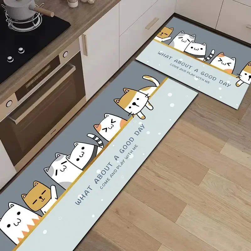 Des chats kawaii sur un tapis de sol dans une cuisine, avec un message joyeux sur la journée.