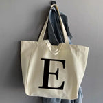 sac main femme toile beige clair lettre noire poignées détachables