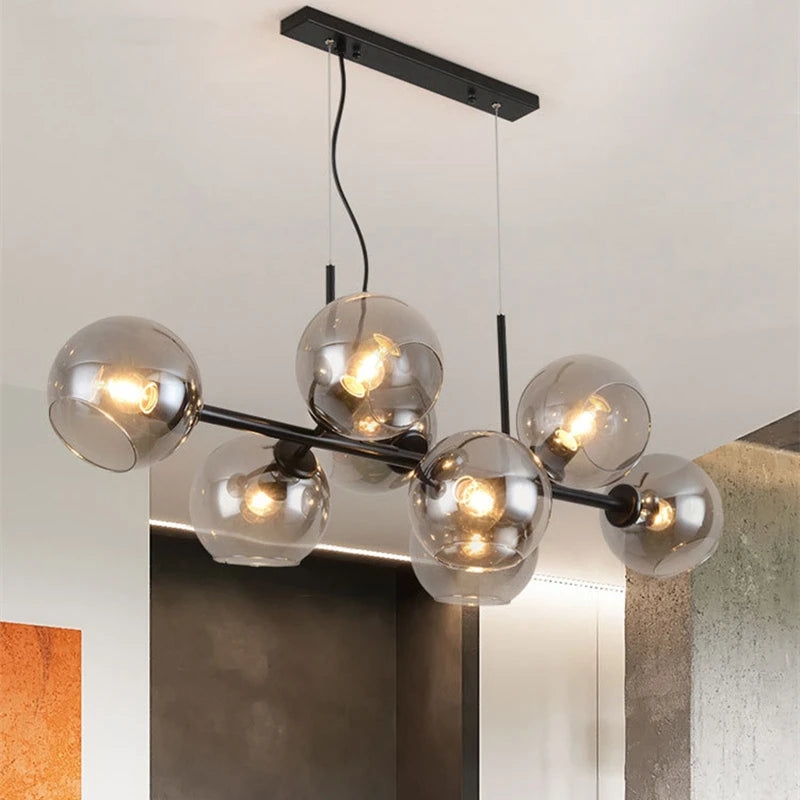 Suspension lumineuse moderne sphères transparentes dorées structure métallique noir chambre salon