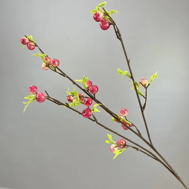 branche artificielle verte feuilles fleurs naturelle extérieure exposition décoration festive vert clair rouge vif