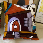housse coussin coton brodé motifs abstraits visages stylisés moderne pop art bleu blanc orange