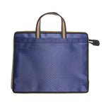 sac main moderne bleu géométrique poignées métalliques carnet stylo papier ruban