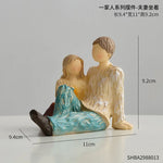 figurines decoratives abstraites famille couple emotions texturées bois sculpté couleurs vases tournesols