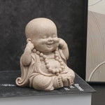 statuettes bouddha enfant résine beige clair marron motifs dorés zen