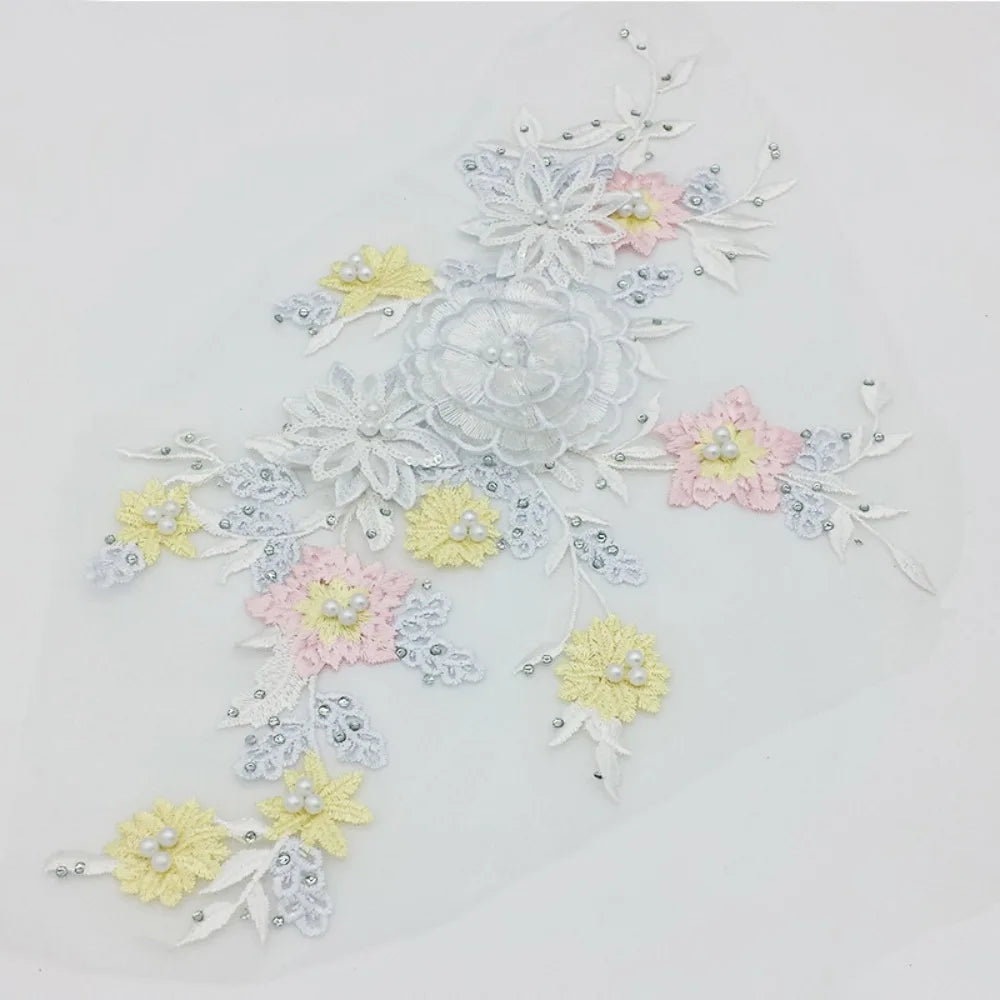 appliques textiles fleurs brodées couleurs rose beige violet vert