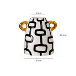 vase céramique rayures noires blanches moderne décoration intérieure arrangement fleurs artificielles minimaliste