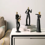 statue musicien moderne abstraite saxophone guitare noire décoration intérieure couple instrumental résine opaque base