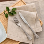 serviettes tissu lin brodé rustique beige feuilles vertes argentées fixations points cousus