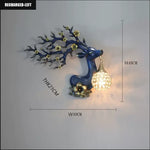 lampe murale moderne branches fleurs strass tête cerf blanc doré bleuclair