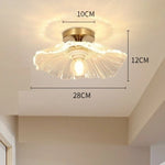 lampe suspendue or transparente motif floral texture ondulée moderne élégante tringle câble