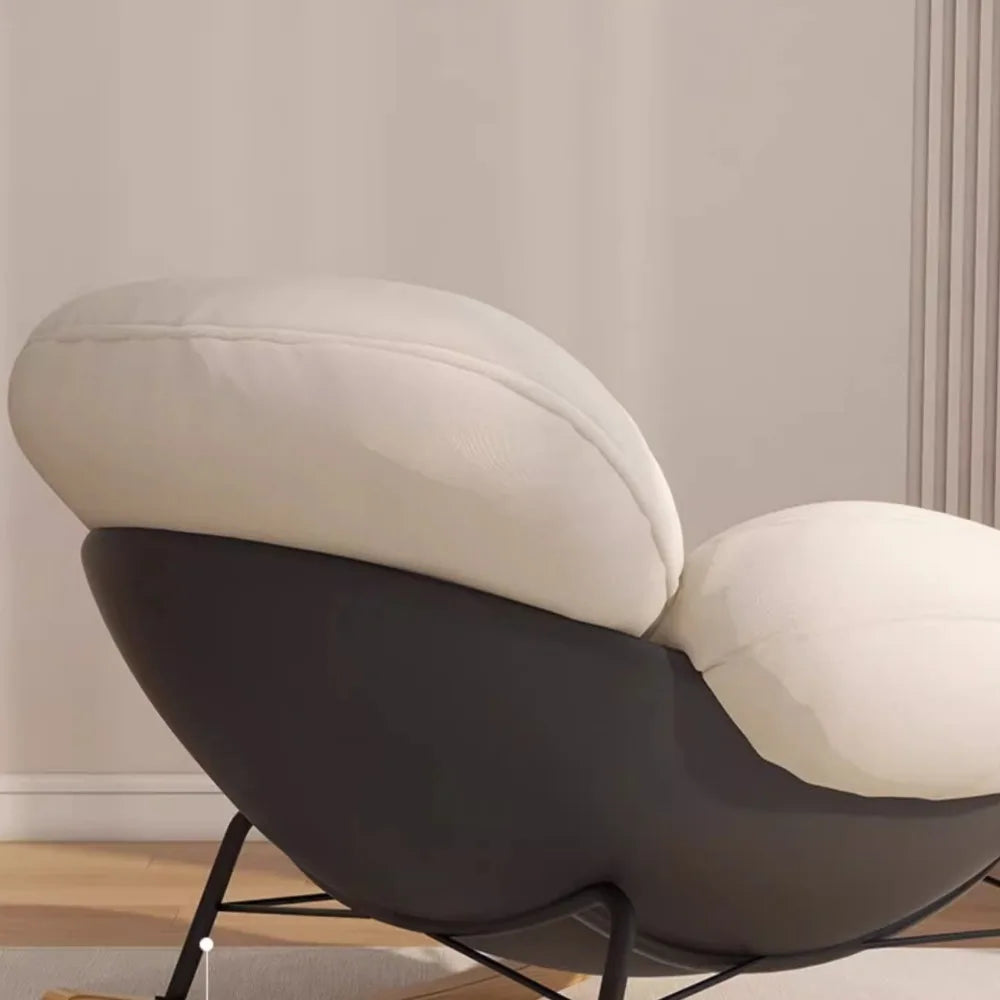 fauteuil bascule moderne beige noir orange roulettes coussin repos minimaliste salon