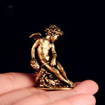 statue ange enfant dorée ailes base végétale renaissance ornement décoration intérieur classique erotique miniature