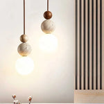 lampe suspendue pierre moderne ampoule g9 blanc beige marron foncé texture granulée lumière opaques