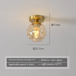 lampe moderne verre transparent noir doré élégante sphérique éclairage contemporain