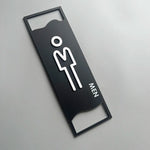 signalisation toilettes moderne symboles homme femme texte TOILET bois brun clair blanc tringle noire