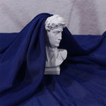 tissu polyester mousseline uni translucide moderne blanc rose bleu violet 150cm cérémonie mariage statuaire