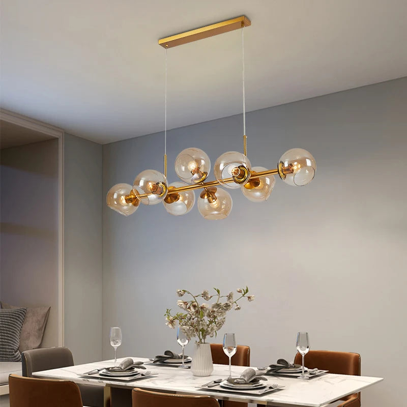 Suspension lumineuse moderne sphères transparentes dorées structure métallique noir chambre salon