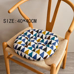 coussin chaise rond moderne couleurs bleu marine blanc vert beige noir motifs géométriques feuilles
