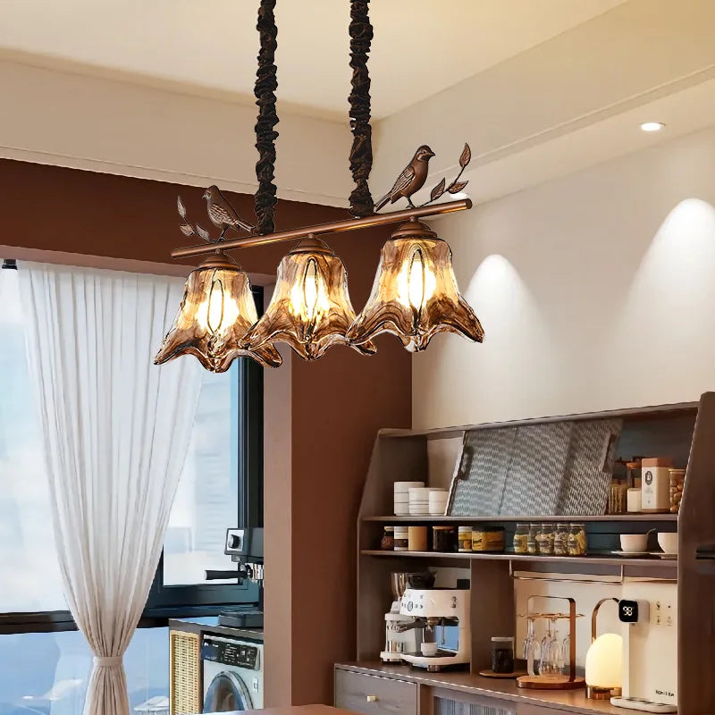 suspension lumineuse marron doré noir verre teinté métal sculpté moderne rustique chaînes noires