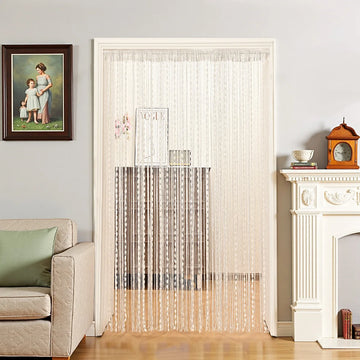 rideau moderne bohème blanc beige rayures pompons fenetre exterieure minimaliste