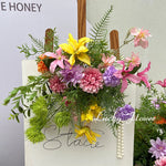 décoration intérieure moderne bouquet fleurs artificielles mixtes violet rose jaune orange verte blanches