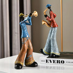 statues musiciens saxophone trompette ethniques motifs floraux bleu marron orange gris