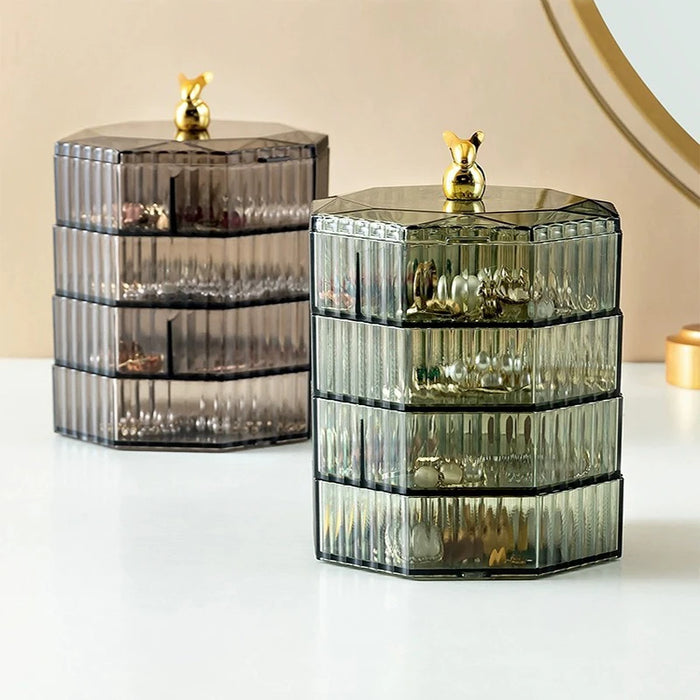 Boîte de rangement rotative transparente pour bijoux sur une table