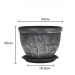 pots fleurs noirs classiques gravures feuilles fleurs plateau drainage visible