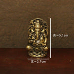 statues ganesha bronze doré sculptures détaillées motifs floraux traditionnel hindou maison