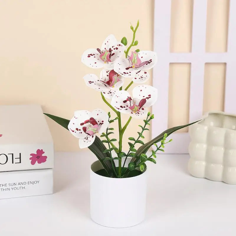 décoration intérieure orchidées artificielles pots blancs fleurs simples feuilles vertes moderne