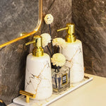 ensemble porte brosse dents porte savon marbre moderne or noir élégant bouteille parfum fleurs