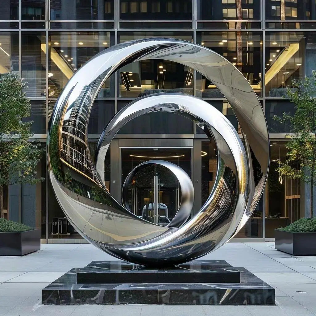 sculpture abstraite métal poli toroïdale forme circulaire décor jardin moderneextérieur