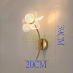 lampe murale moderne élégante fleur dorée pétales transparents éclairage cuisine salle manger