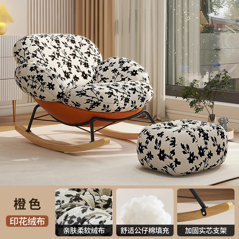 fauteuil bascule moderne beige noir orange roulettes coussin repos minimaliste salon
