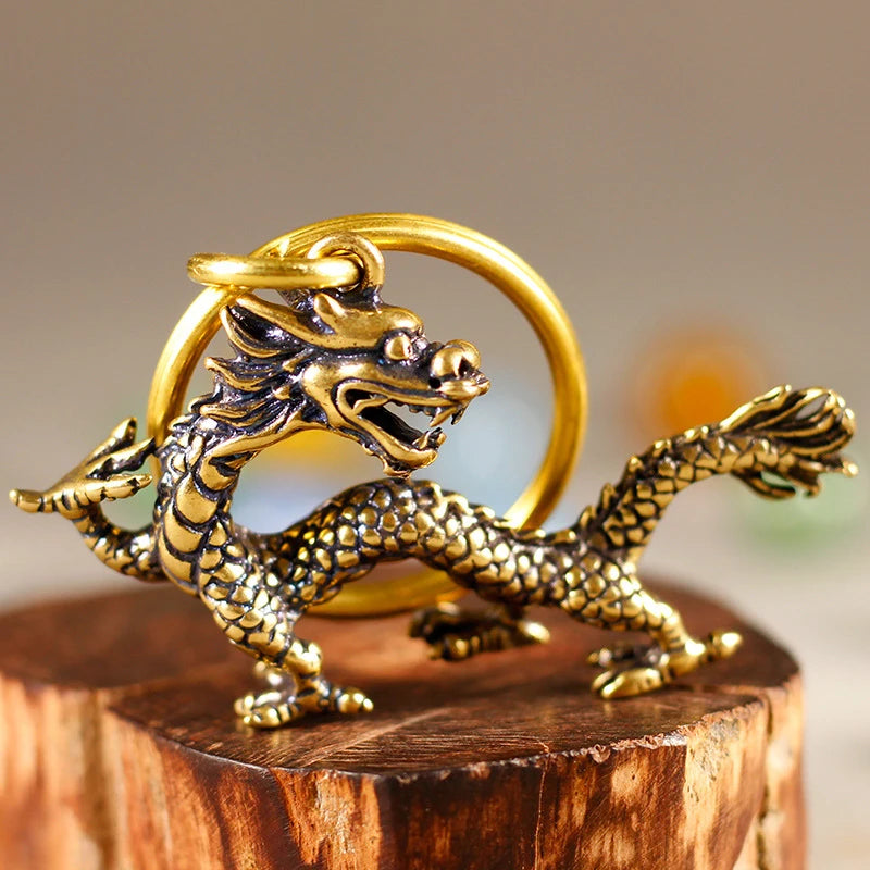 pendantin dragon doré écailles cuivre artisanal anneau inclusionOpaque ancien maison