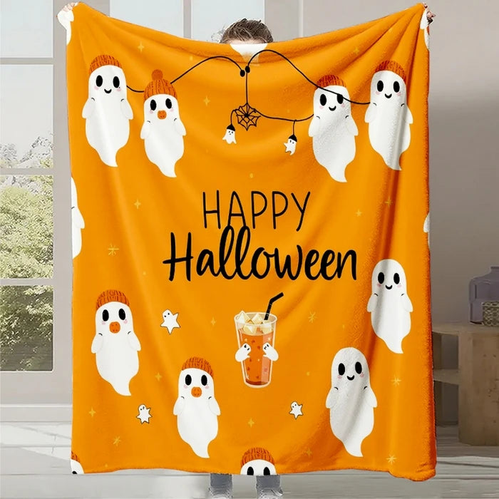 Couverture orange décorative de Halloween avec des fantômes blancs et le texte "Happy Halloween" accompagné de divers éléments festifs.