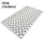 tapis bain antidérapant gris moderne perforations circulaires salle bain respectueux environnement