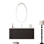 meuble salle bain noir blanc tiroirs vasque ornements dorés classique fixations murales accessoires cosmétiques