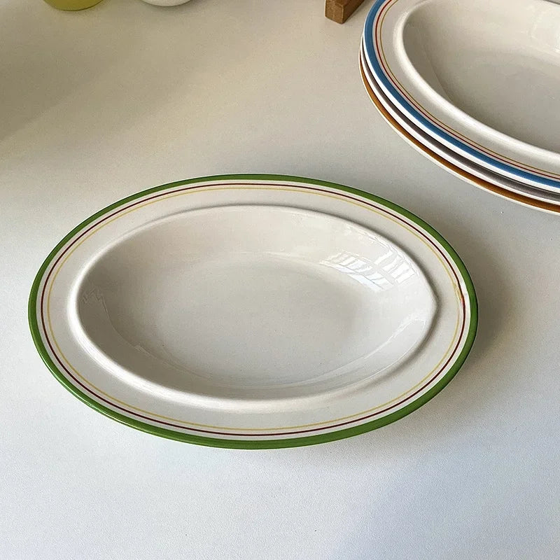 assiettes ovales rayées blanc bleu orange brun vaisselle classique décoration table servir plats après