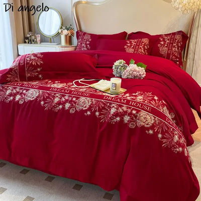Parure de lit en coton égyptien brodée rouge sur lit queen
