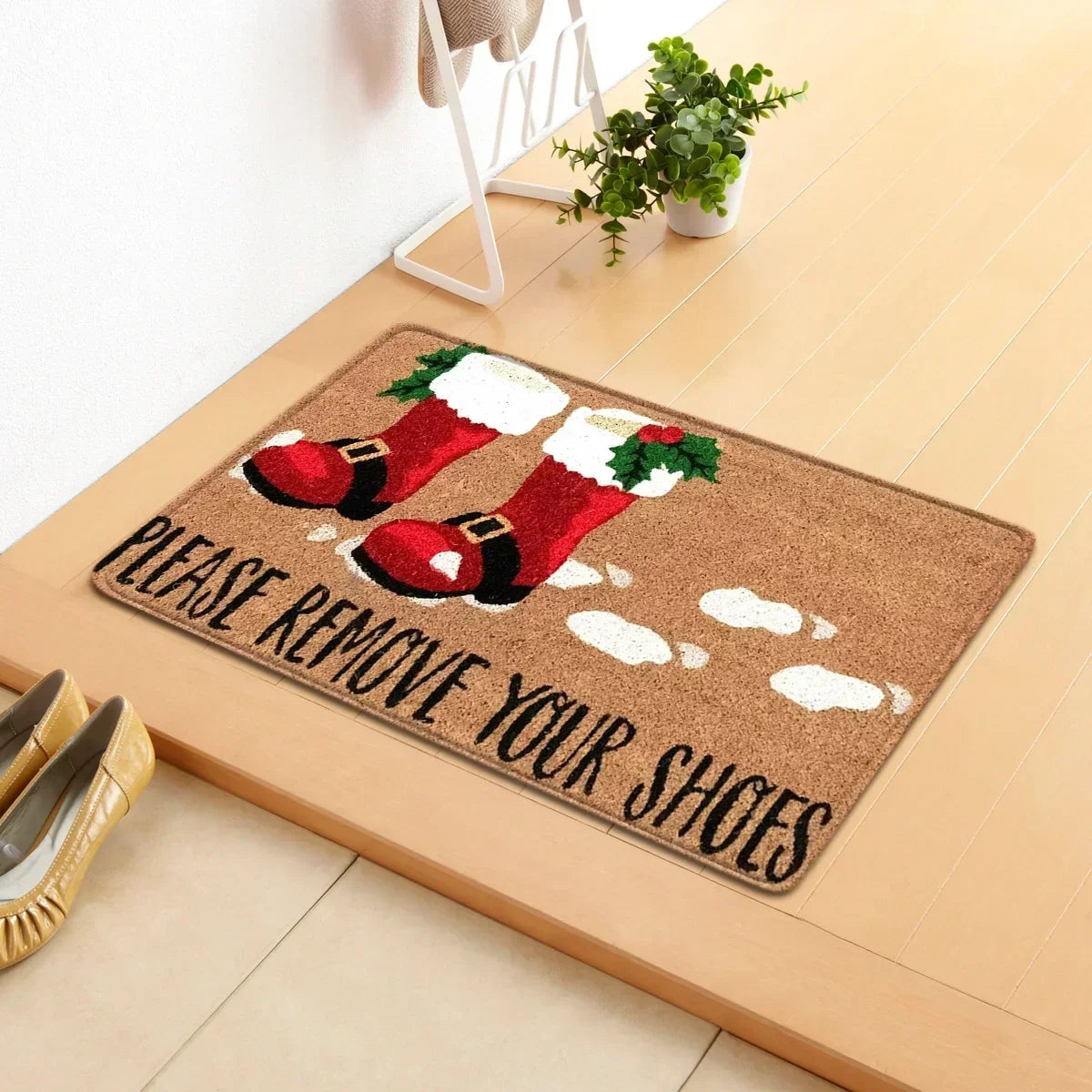 Paillasson de Noël placé à l'entrée d'une maison décorée